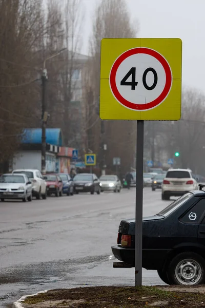 Speed limit road sign, on a city road. The speed limit of vehicles is regulated by a road sign.