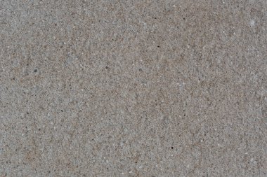 Granit parçalardan yapılmış, güzel bir dokusu olan desenli bir duvar. Arka planda granit cips ve çimento harcı duvarı var. Duvarın dokusu granit parçacıklar ve çimentodan yapılmıştır..