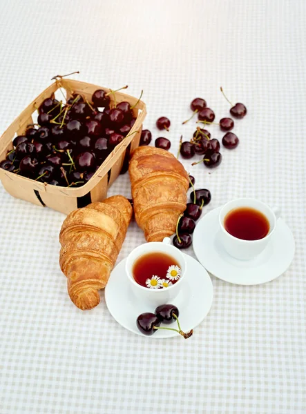 Black Tea Fresh Croissants Cherries Table White Background Flat Lay — стоковое фото