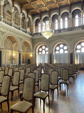 a performance hall with lots of chairs and beautiful interior