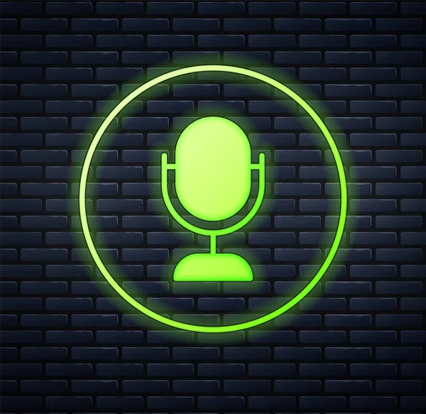 Glowing neon Microphone icon isolated on brick wall background. On air radio mic microphone. Speaker sign. Vector — Stock Vector