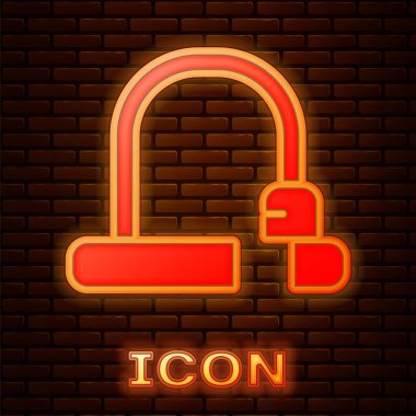 Parlayan neon bisiklet kilidi U şeklindeki sanayi simgesi tuğla duvar arkasında izole edilmiş. Vektör.