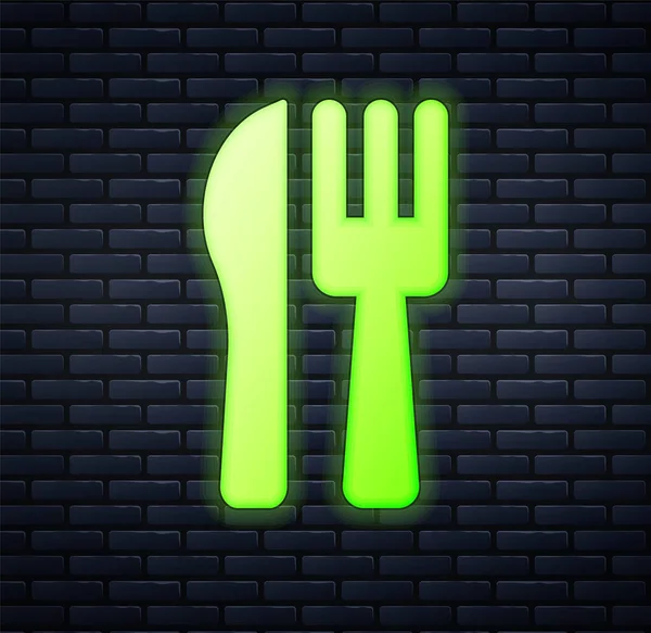 Glowing neon Crossed knife and fork icon isolated on brick wall background. Cutlery symbol. Vector — Stock Vector