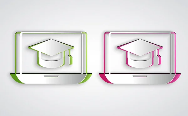 Papier gesneden Graduation cap op scherm laptop pictogram geïsoleerd op grijze achtergrond. Online leren of e-learning concept. Papierkunst stijl. Vector — Stockvector
