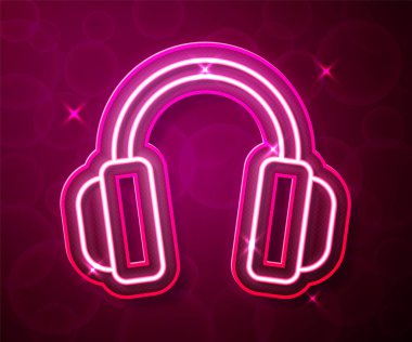 Parlayan neon hattı kulaklık simgesi kırmızı arkaplanda izole edildi. Kulaklıklar. Müzik, hizmet, iletişim ve operatör konsepti. Vektör
