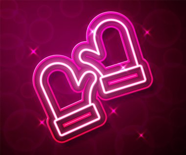 Glowing neon line Pair of knitted christmas mittens icon isolated on red background. Mitten icon. Merry Christmas and Happy New Year.  Vector