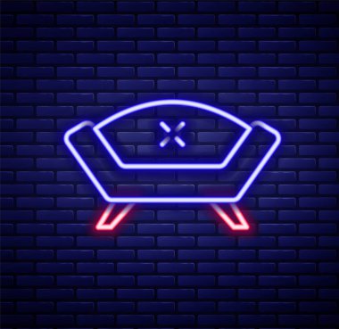 Parlayan neon hattı kanepe simgesi tuğla duvar arka planında izole edildi. Renkli taslak konsepti. Vektör