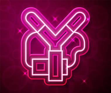 Glowing neon line Slingshot icon isolated on red background. Vector