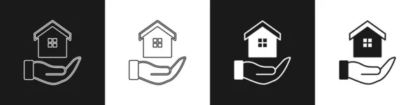 Set Maison Dans Main Icône Isolée Sur Fond Noir Blanc — Image vectorielle