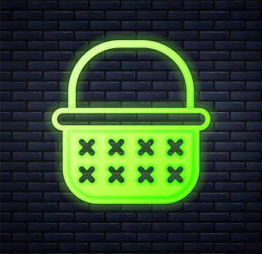 Işıldayan neon renkli sepet simgesi tuğla duvar arkasında izole edildi. Vektör.