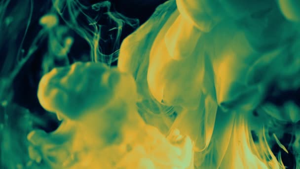 Abstract thick green smoke rising up on a dark background. — Video