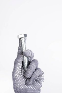 İnşaat malzemeleri. Beyaz bir arka planda elinde sürgü var. Beyaz arkaplanda sürgü