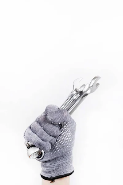 Baustoffe Schraubenschlüssel Auf Weißem Hintergrund Eine Behandschuhte Hand Hält Schraubenschlüssel — Stockfoto