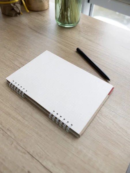 Checkered Notepad Black Pen Wooden Table —  Fotos de Stock