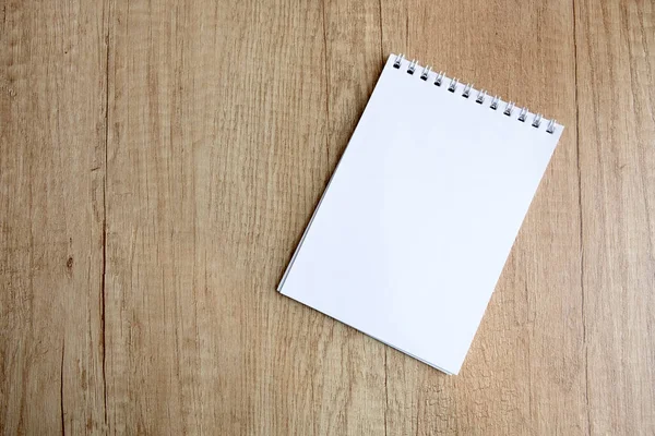 Checkered Notepad Wooden Table Free Space —  Fotos de Stock