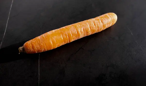 Big Carrot Table Black Background — Stockfoto