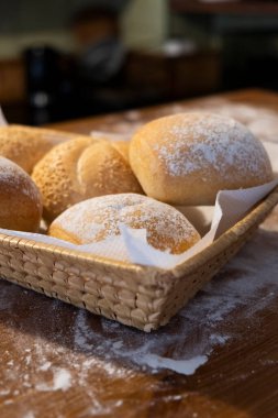 Various buns in a basket on the table