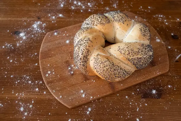 Bun Poppy Seeds Wooden Board Table Sprinkled Flour Side View — 图库照片