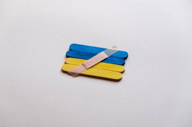 medical plaster on the flag of ukraine. Defense of Ukraine