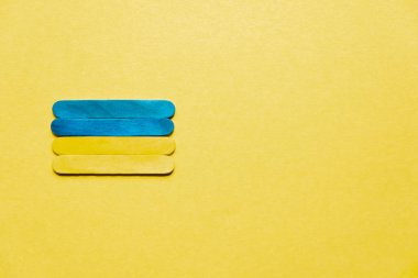 Flag of Ukraine on a yellow background, free space