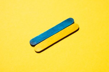 Flag of Ukraine on a yellow background in the center