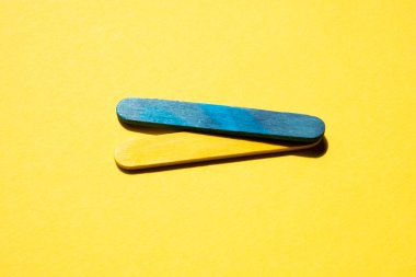 blue and yellow stripes on a yellow background