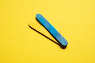 blue and yellow stripes on a yellow background