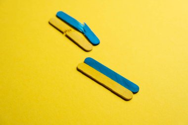 broken flag and normal flag of ukraine side view. War symbol. Restoration of Ukraine