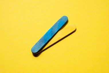 stripes in the colors of the flag of ukraine on a yellow background