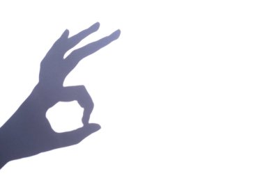 shadow gesture ok on white background, free space