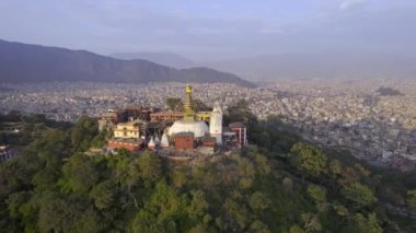 Aerial view circling around Swayambhunath Stupa viewing the city of Kathmandu in Nepal.