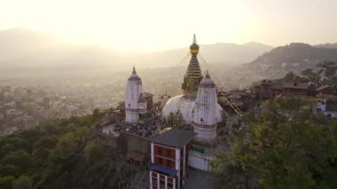 Aerial view circling around Swayambhunath Stupa on hilltop in Kathmandu Nepal.