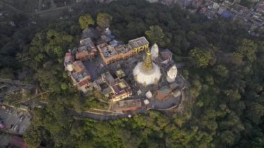 Looking down at Swayambhunath Stupa from aerial view revealing Kathmandu in Nepal.