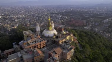 Circling around Swayambhunath Stupa viewing the city of Kathmandu in Nepal.