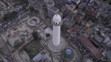 Flying up and over the Dharahara Tower looking down at it in Kathmandu.