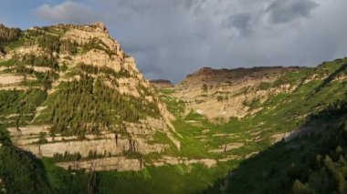 Aerial of Timpanogos Mountain from Aspen Grove flying up the canyon on a summer morning.