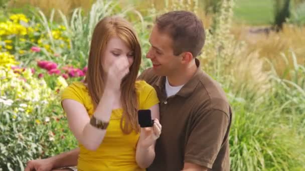 Young Man Proposes Young Woman Beautiful Garden — Stock Video
