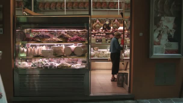 Medium Wide Shot Nun Walking Cheese Shop Bologna Italy — Stock Video