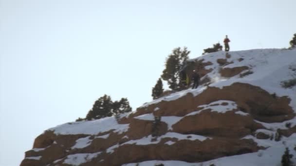 Base Jumper Skis Mountain Slope Reaches Edge Bends Back Flip — Stock Video
