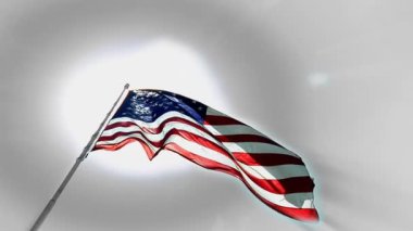 Arkadan yayılan bu ışınları ile stilize güneşe karşı ağır çekimde sallayarak bir Amerikan bayrağı yukarı bir göz.