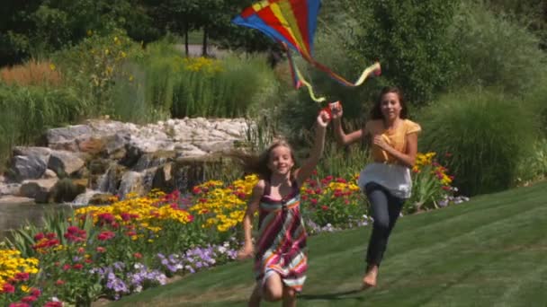 Slow Motion Two Sisters Playing Kites Beautiful Garden — Stock Video