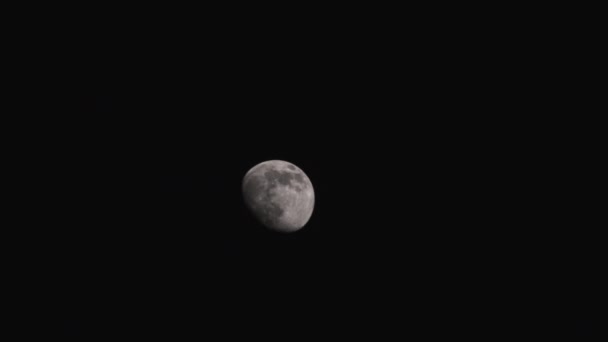 Waxing Gibbous Moon Slowly Moves Right Camera Black Starless Night — Stock Video