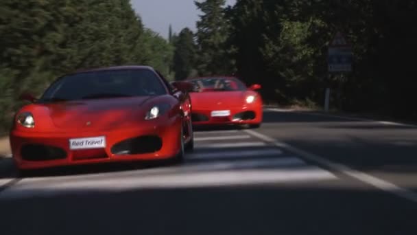 Wide Shot Two Ferraris Driving Road — Stock Video