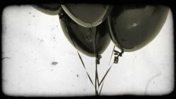 Tilting Shot Cluster Black Ballons Vintage Stylized Video Clip — Stock Video