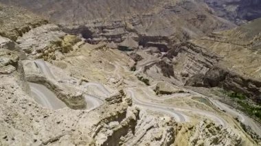 Flying over winding dirt road in the Mustang Region in Nepal.