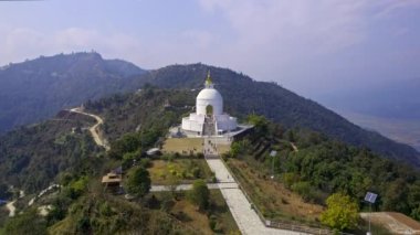 Flying towards the World Peace Pagoda in a hilltop in Pokhara, Nepal.