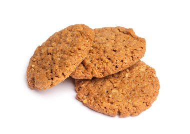 Beyaz arka planda yulaf ezmeli, vanilyalı kurabiyeler. Yakın çekim görünümü