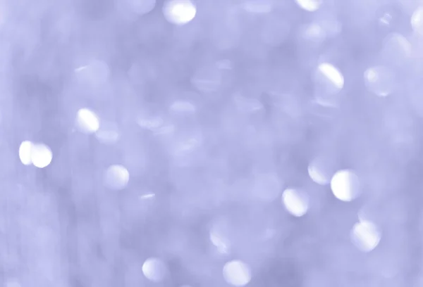 Soyut bokeh arkaplanı. Açık mavi duvar kâğıdı. 2022 yılının rengi. Parlak, bulanık, parıldayan bir çelenk..