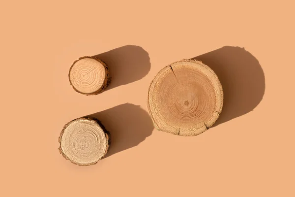 stock image Three woodcut disks lying on a trendy beige background 