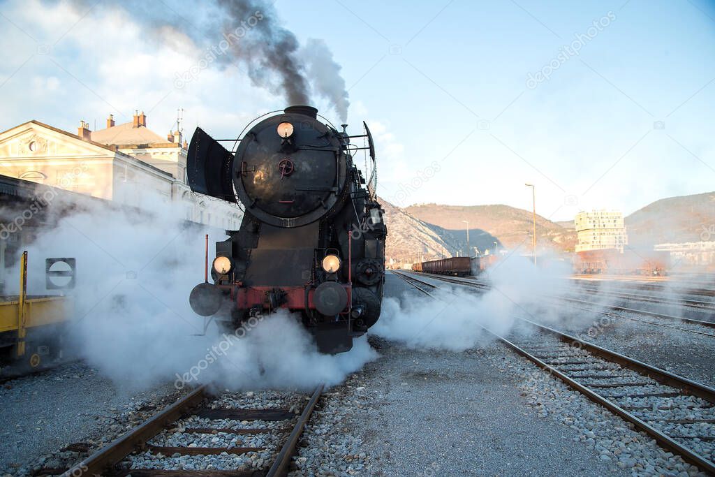 Old Steam train - locomotive is leaving the Railway Station at Nova Gorica, Slovenia, Europe